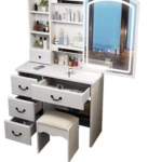 dressing table, dressing tables, vanity table, vanity desk, makeup table, makeup vanity, bedroom dressing table, bedroom vanity table, modern dressing table, modern vanity table, elegant dressing table, stylish dressing table, contemporary dressing table, luxury dressing table, premium dressing table, wooden dressing table, MDF dressing table, bedroom furniture, bedroom furniture Kenya, dressing room table, dressing station, makeup station, beauty table, beauty vanity, cosmetic table, cosmetic vanity, ladies dressing table, women's dressing table, ladies vanity table, bedroom vanity, home vanity table, home dressing table, dressing cabinet, vanity cabinet, dressing table with mirror, dressing table mirror, vanity table with mirror, makeup table with mirror, dressing table with drawers, dressing table with storage, vanity table with drawers, vanity table with storage, makeup vanity with drawers, dressing table organizer, vanity organizer, cosmetic organizer table, jewelry storage table, bedroom storage table, compact dressing table, small dressing table, large dressing table, spacious dressing table, corner dressing table, wall mounted dressing table, floating dressing table, freestanding dressing table, portable dressing table, space saving dressing table, multifunctional dressing table, functional dressing table, practical dressing table, durable dressing table, quality dressing table, affordable dressing table, luxury vanity furniture, premium vanity furniture, bedroom vanity furniture, modern bedroom furniture, contemporary bedroom furniture, home bedroom furniture, dressing room furniture