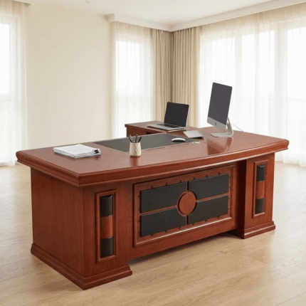 1.8m Mahogany Managerial Desk Upgrade your office with the 1.8m Mahogany Managerial Desk, a spacious and professional workstation designed for managers, executives, and modern office environments. Its 1.8-meter desktop provides ample working space for computers, monitors, documents, stationery, and essential office accessories. The Mahogany Managerial Desk combines a professional appearance with practical workspace, making it suitable for managerial offices, corporate workspaces, administrative departments, and other professional environments. Key Features 1.8-meter spacious desktop for comfortable daily work Mahogany finish for a professional appearance Suitable for managerial and executive offices Ample space for computers, monitors, and documents Practical surface for paperwork and office accessories Professional design for modern office interiors Suitable for individual workstations Easy to pair with executive and managerial office chairs Ideal for corporate and commercial offices Helps create an organized and professional workspace Spacious Managerial Workspace The 1.8m Mahogany Managerial Desk provides generous workspace for managers who require room for multiple office essentials. The large desktop can accommodate a computer setup, documents, stationery, and other equipment while leaving useful space for everyday tasks. Its 1.8-meter width also provides a practical balance between workspace and office floor requirements. Professional Mahogany Office Design The mahogany finish gives this 1.8m managerial desk a classic and professional appearance. Its versatile design can complement different office furniture and interior styles. Pair the desk with a managerial office chair, visitor chairs, filing cabinet, mobile pedestal, or office storage unit to create a complete and coordinated executive workspace. Ideal Applications The 1.8m Mahogany Managerial Desk is suitable for: Managerial offices Executive offices Corporate workplaces Administrative departments Small and medium-sized businesses Private offices Professional workspaces Commercial offices Consultation rooms Business environments