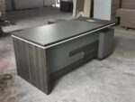 1800mm Grey L-Shaped Desk, 1800mm L-shaped desk, grey L-shaped desk, 1.8m L-shaped desk, L-shaped office desk, L-shaped executive desk, L-shaped workstation, grey office desk, grey executive desk, executive office desk, modern office desk, office workstation, corner office desk, corner workstation, large office desk, spacious office desk, 1800mm office desk, 1800mm executive desk, 1800mm workstation, 1.8m office desk, 1.8 meter desk, grey workstation, modern L-shaped workstation, contemporary office desk, professional office desk, corporate office desk, manager office desk, executive workstation, managerial desk, director office desk, CEO office desk, business office desk, office furniture Kenya, office desk Kenya, office furniture Nairobi, office desk Nairobi, L-shaped desk Kenya, L-shaped desk Nairobi, workstation Kenya, workstation Nairobi, modern furniture Kenya, modern office furniture, corporate furniture Kenya, executive furniture Kenya, ergonomic office desk, ergonomic workstation, spacious workstation, productive workspace, office workspace furniture, workplace desk, business workstation, employee workstation, manager workstation, private office desk, executive office furniture, contemporary office furniture, grey office furniture, grey desk Kenya, grey workstation Kenya, corner desk Kenya, corner desk Nairobi, office corner desk, space saving office desk, space efficient workstation, large L-shaped workstation, multi-purpose office desk, computer workstation desk, computer office desk, laptop workstation, office computer desk, professional workstation desk, durable office desk, sturdy workstation, quality office desk Kenya, affordable office desk Kenya, custom office furniture, office storage desk, executive work desk, executive office workstation, modern executive desk, sleek office desk, stylish office workstation, minimalist office desk, contemporary workstation, corporate workstation, business office furniture, commercial office desk, administrative workstation, clerical office desk, home office L-shaped desk, home office workstation, work from home desk, 1800mm L-shaped workstation, grey executive workstation, 1800mm Grey L-Shaped Desk Kenya.