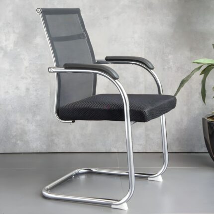 Black Mesh Cantilever Office Chair This Black Mesh Cantilever Office Chair is a stylish and practical seating solution designed for modern offices, meeting rooms, reception areas, and visitor spaces. Featuring a breathable black mesh backrest, cushioned seat, supportive armrests, and a sturdy chrome-plated cantilever frame, this chair delivers a comfortable seating experience with a clean professional appearance. Key Features Breathable Mesh Backrest – Promotes airflow and helps keep you comfortable during extended sitting. Comfortable Padded Seat – Provides supportive cushioning for office and meeting use. Ergonomic Back Support – Contoured backrest helps provide comfortable upper-body support. Integrated Armrests – Offers convenient support for the arms while seated. Strong Chrome Cantilever Frame – Provides stability, durability, and a modern appearance. Non-Swivel Design – Stable fixed seating, ideal for meetings and visitor areas. Modern Black Finish – Easily complements a wide range of office interiors. Professional Appearance – Creates a smart and welcoming look for business environments. Versatile Use – Suitable for boardrooms, conference rooms, reception areas, offices, and waiting spaces. Easy to Maintain – Mesh upholstery and smooth metal surfaces are simple to clean. Ideal For Boardrooms • Meeting Rooms • Reception Areas • Visitor Seating • Executive Offices • Waiting Areas • Conference Rooms • Training Rooms