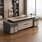 240CM Solid Executive Desk  Command the room with the 240CM Solid Executive Desk, a massive statement piece engineered for senior executives, directors, and leaders who require maximum surface space and refined elegance. Spanning an expansive 2.4 meters, this high-end desk balances luxurious design with structural durability to transform any corporate suite or spacious home office. Key Features Expansive 240cm Surface: Offers immense workspace for multiple monitors, conference call setups, and extensive document organization. Solid Heavy-Duty Construction: Built with premium high-density materials to ensure long-lasting stability, strength, and durability. Built-in Storage Solutions: Includes integrated drawers, side cabinets, and lockable compartments to keep confidential files organized. Integrated Wire Management: Built-in grommets and cable channels keep power cords hidden and clutter-free. Polished Professional Finish: Features rich wood grain textures and smooth edge detailing for an authoritative corporate aesthetic. Designed for Leadership & Productivity A expansive desk creates a clear and structured work process. The 240CM Solid Executive Desk provides ample space to host small face-to-face discussions, review large blueprints, or manage multi-screen digital workflows simultaneously. Its ergonomic layout ensures all essential tools remain within easy reach while maintaining a clean, clutter-free desktop. Premium Craftsmanship for High-Impact Offices Crafted to serve as the focal point of executive suites, this desk combines traditional authority with modern office functionality. The sturdy frame supports heavy office equipment effortlessly, while the rich finish protects against daily wear, scratches, and stains—preserving its professional look for years to come. Ideal Applications Executive and C-Suite office suites Boardrooms and management offices Spacious home office setups Law firms and financial consulting offices Government and institutional leadership suites